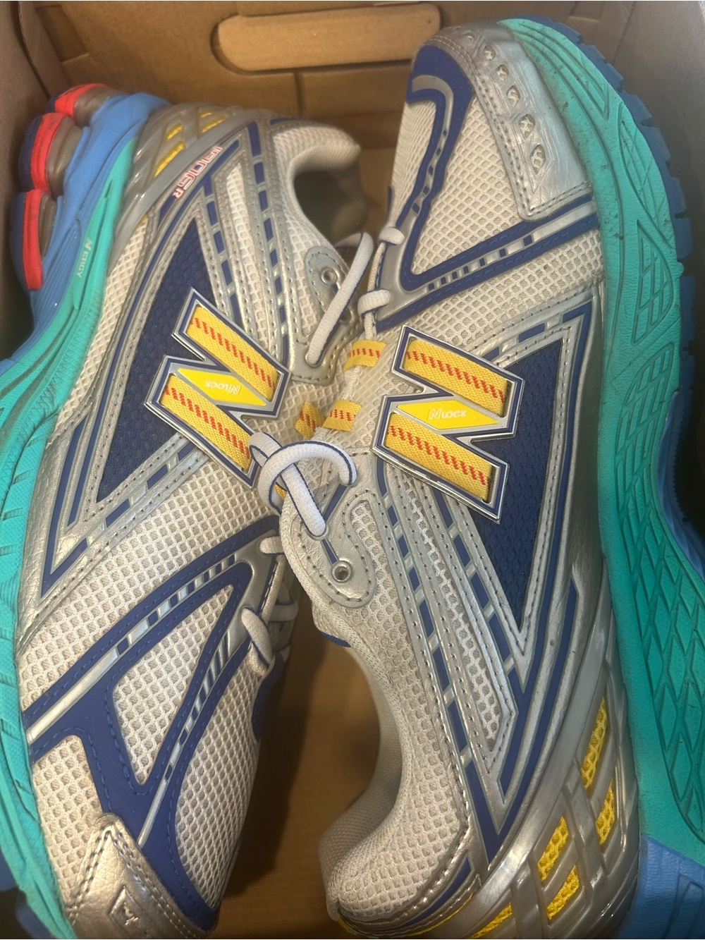 New Balance Silver, Navy & Teal Running Shoes with Yellow Accents
